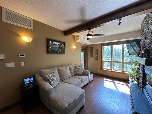 2203 - 7495 Columbia Avenue, Radium Hot Springs, BC - Indoor Photo Showing Living Room With Fireplace