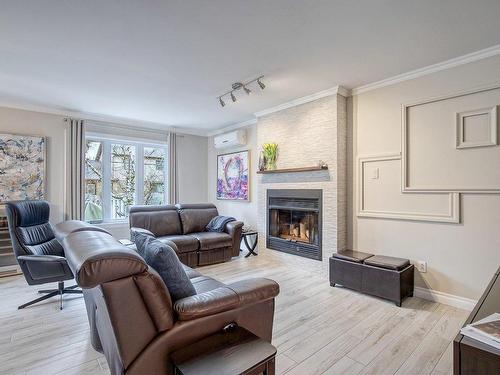 Living room - 370 Rue Léotable-Dubuc, La Prairie, QC - Indoor Photo Showing Living Room With Fireplace