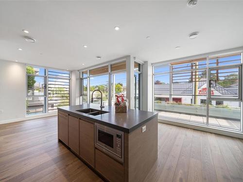 205-1916 Oak Bay Ave, Victoria, BC - Indoor Photo Showing Kitchen With Double Sink