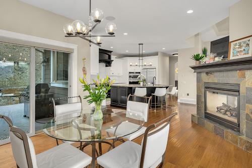 158 Terrace Hill Court, Kelowna, BC - Indoor Photo Showing Dining Room With Fireplace