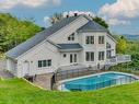 FaÃ§ade - 25 Ch. Des Amarantes, Sainte-Anne-Des-Lacs, QC  - Outdoor With In Ground Pool 