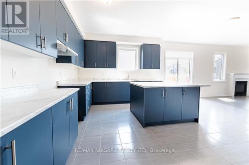 25 Oriole Crescent, Port Colborne, ON - Indoor Photo Showing Kitchen With Fireplace