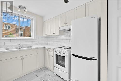 2490 Rivard Avenue Unit# 9, Windsor, ON - Indoor Photo Showing Kitchen With Double Sink