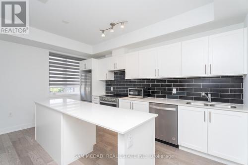 223 - 1070 Douglas Mccurdy Comm, Mississauga (Lakeview), ON - Indoor Photo Showing Kitchen With Double Sink