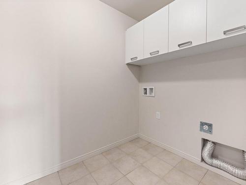 Laundry room - D-04-150 Rue De La Maçonnerie, Châteauguay, QC - Indoor Photo Showing Other Room