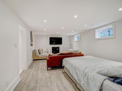 26 Vanderbrent Cres, Toronto, ON - Indoor Photo Showing Bedroom With Fireplace