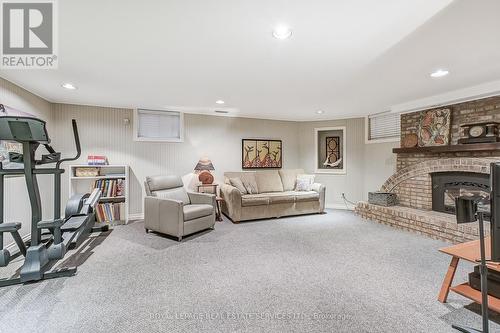 1242 Kensington Park Road, Oakville (Iroquois Ridge South), ON - Indoor Photo Showing Gym Room With Fireplace