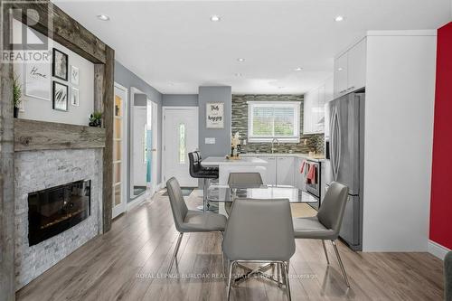 55 - 120 Quigley Road, Hamilton (Vincent), ON - Indoor Photo Showing Dining Room With Fireplace