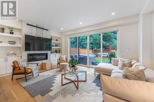 1 Hunt Club Drive, Toronto (Birchcliffe-Cliffside), ON - Indoor Photo Showing Living Room With Fireplace