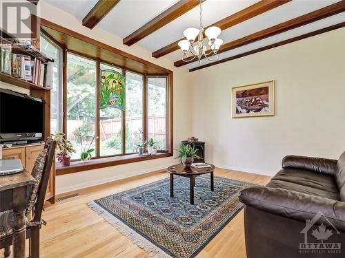 Sunken Family room with Vermont gas stove - 1820 Dunkirk Crescent, Ottawa, ON - Indoor Photo Showing Living Room