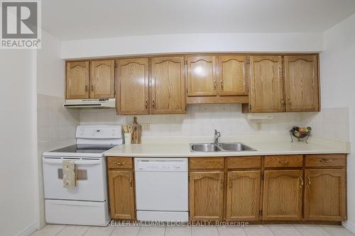 56 - 3050 Pinemeadow Drive, Burlington (Headon), ON - Indoor Photo Showing Kitchen With Double Sink