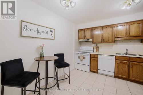 56 - 3050 Pinemeadow Drive, Burlington (Headon), ON - Indoor Photo Showing Kitchen With Double Sink