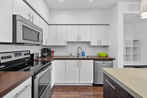 301-975 Academy Way, Kelowna, BC - Indoor Photo Showing Kitchen With Double Sink