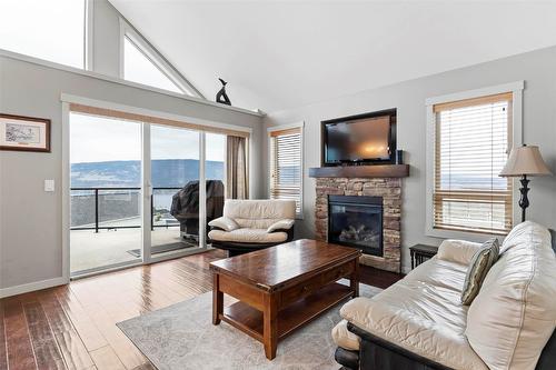 6953 Terazona Drive, Kelowna, BC - Indoor Photo Showing Living Room With Fireplace