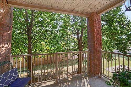 Tree-lined view of balcony - 3050 Pinemeadow Drive|Unit #56, Burlington, ON - Outdoor With Balcony With Exterior