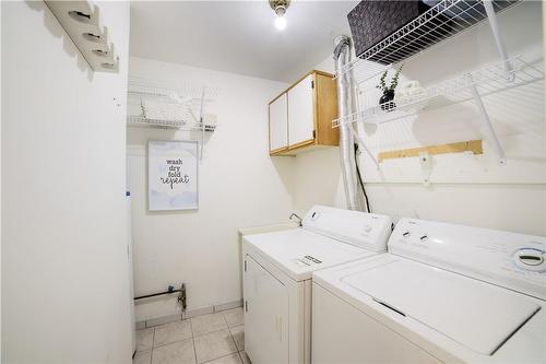 In suite laundry room with storage - 3050 Pinemeadow Drive|Unit #56, Burlington, ON - Indoor Photo Showing Laundry Room