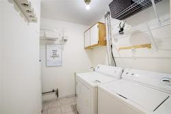 In suite laundry room with storage - 