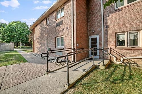 Accessible ramp located at the rear of building - 3050 Pinemeadow Drive|Unit #56, Burlington, ON - Outdoor With Deck Patio Veranda With Exterior