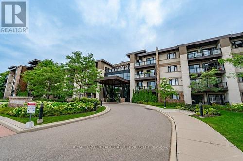 417 - 128 Garden Drive, Oakville, ON - Outdoor With Balcony With Facade