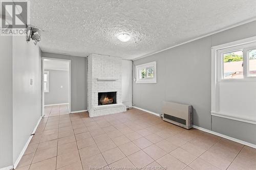 99 Mill Street, Leamington, ON - Indoor With Fireplace