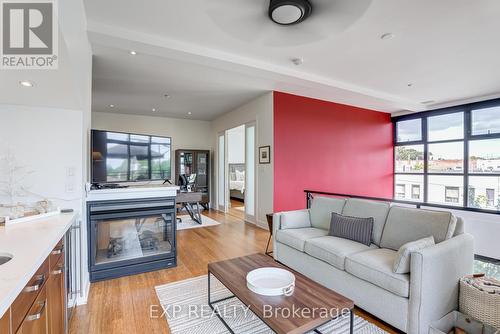 212 - 160 Fallingbrook Road, Toronto (Birchcliffe-Cliffside), ON - Indoor Photo Showing Living Room With Fireplace