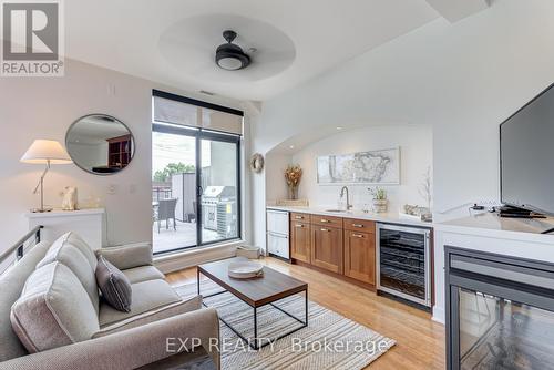 212 - 160 Fallingbrook Road, Toronto (Birchcliffe-Cliffside), ON - Indoor Photo Showing Living Room With Fireplace