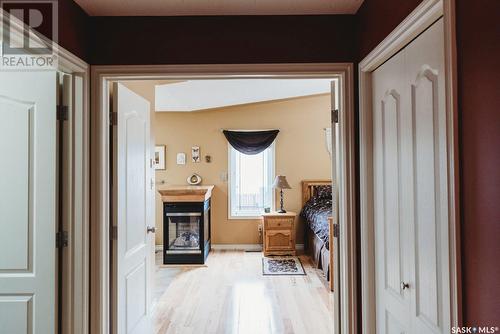 134 Collins Street, Creighton, SK - Indoor Photo Showing Other Room With Fireplace