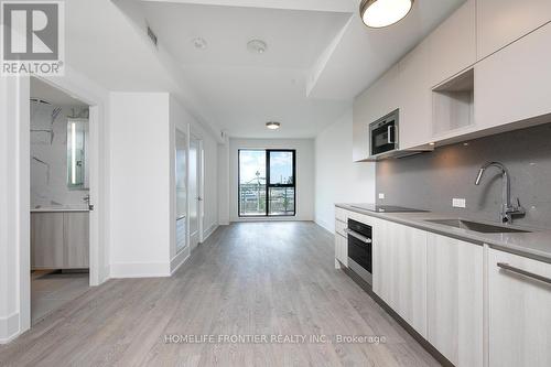 219 - 118 Merchants' Wharf, Toronto (Waterfront Communities), ON - Indoor Photo Showing Kitchen With Upgraded Kitchen