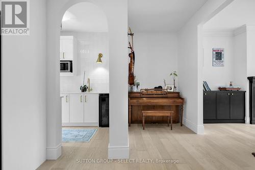 Arched entry into butlers pantry w/ wet bar - 46 Exmoor Place, London, ON - Indoor Photo Showing Other Room