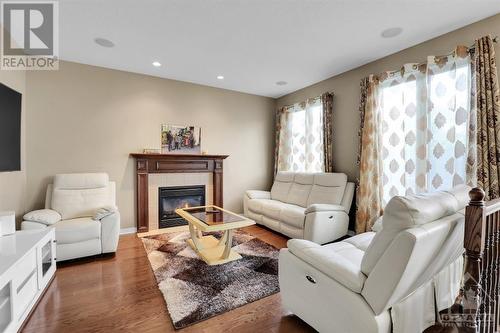 Family room - 100 Monterossa Street, Ottawa, ON - Indoor Photo Showing Living Room With Fireplace