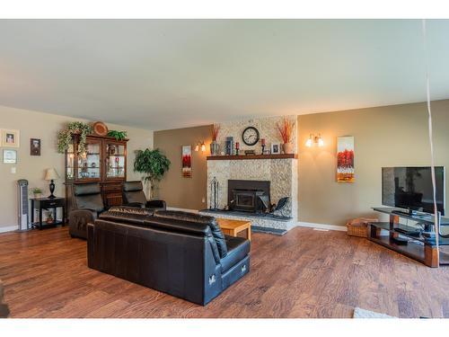 103 Johnson Road, Fruitvale, BC - Indoor Photo Showing Living Room With Fireplace