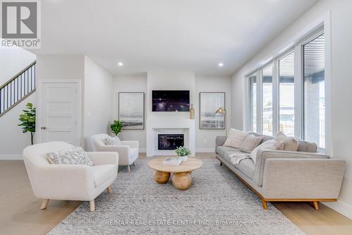 4 - 7966 Fallon Drive, London, ON - Indoor Photo Showing Living Room With Fireplace