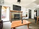 2070 Summit Drive Unit# 306, Panorama, BC  - Indoor Photo Showing Living Room With Fireplace 