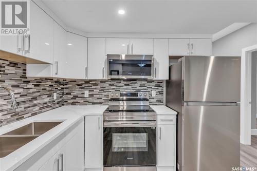 506 Taskamanwa Street, Saskatoon, SK - Indoor Photo Showing Kitchen With Double Sink With Upgraded Kitchen