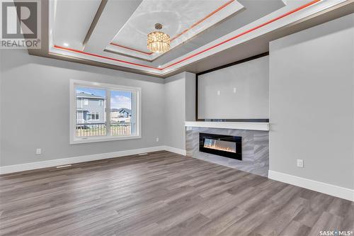 506 Taskamanwa Street, Saskatoon, SK - Indoor Photo Showing Living Room With Fireplace