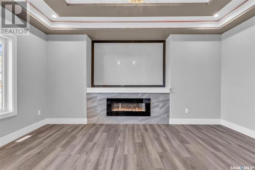 506 Taskamanwa Street, Saskatoon, SK - Indoor Photo Showing Other Room With Fireplace