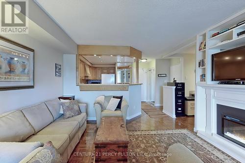 814 - 711 Rossland Road E, Whitby (Pringle Creek), ON - Indoor Photo Showing Living Room With Fireplace