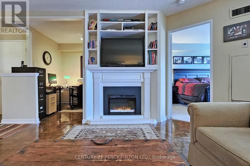 814 - 711 Rossland Road E, Whitby, ON - Indoor Photo Showing Living Room With Fireplace