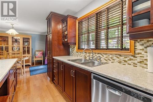 Kitchen windows looking onto backyard - 130 Hartley Street, Brockville, ON - Indoor Photo Showing Kitchen With Double Sink