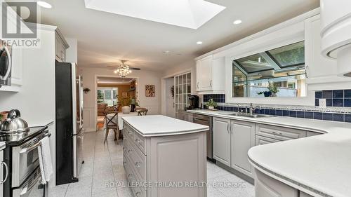 Skylight adds lots of natural light - 21709 Wonderland Road N, Middlesex Centre, ON - Indoor Photo Showing Kitchen With Double Sink