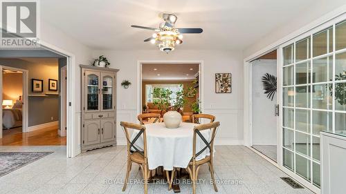 eat in kitchen with views of sunroom and living rm - 21709 Wonderland Road N, Middlesex Centre, ON - Indoor Photo Showing Other Room