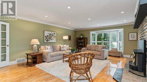 Huge family room with french doors. - 21709 Wonderland Road N, Middlesex Centre, ON - Indoor Photo Showing Living Room