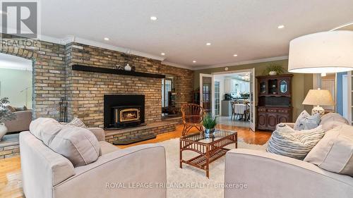 Wood firepalce - 21709 Wonderland Road N, Middlesex Centre, ON - Indoor Photo Showing Living Room With Fireplace