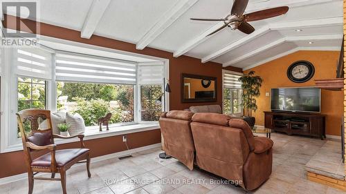 Lots of great windows to enjoy the view - 21709 Wonderland Road N, Middlesex Centre, ON - Indoor Photo Showing Living Room