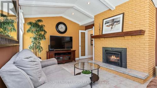 Gas fireplace - 21709 Wonderland Road N, Middlesex Centre, ON - Indoor Photo Showing Living Room With Fireplace