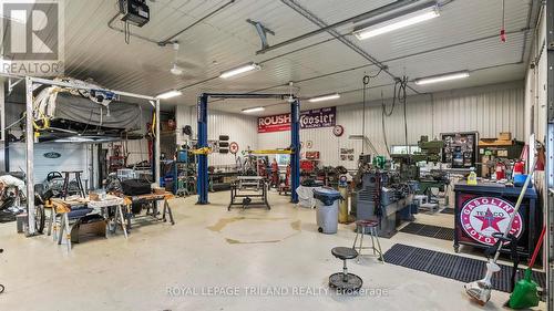 In-floor heated shop with 2 piece bath - 21709 Wonderland Road N, Middlesex Centre, ON - Indoor Photo Showing Garage