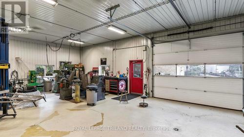 100 amp service, 2 garage doors - 21709 Wonderland Road N, Middlesex Centre, ON - Indoor Photo Showing Garage