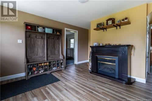 693 555 Route, Richmond Corner, NB - Indoor Photo Showing Living Room With Fireplace