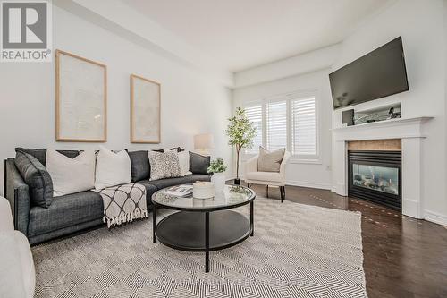 125 - 123 Myers Lane, Hamilton (Ancaster), ON - Indoor Photo Showing Living Room With Fireplace