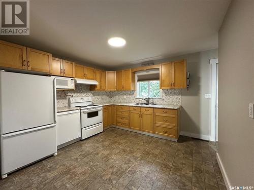 13 Oswalt Street, Quill Lake, SK - Indoor Photo Showing Kitchen With Double Sink